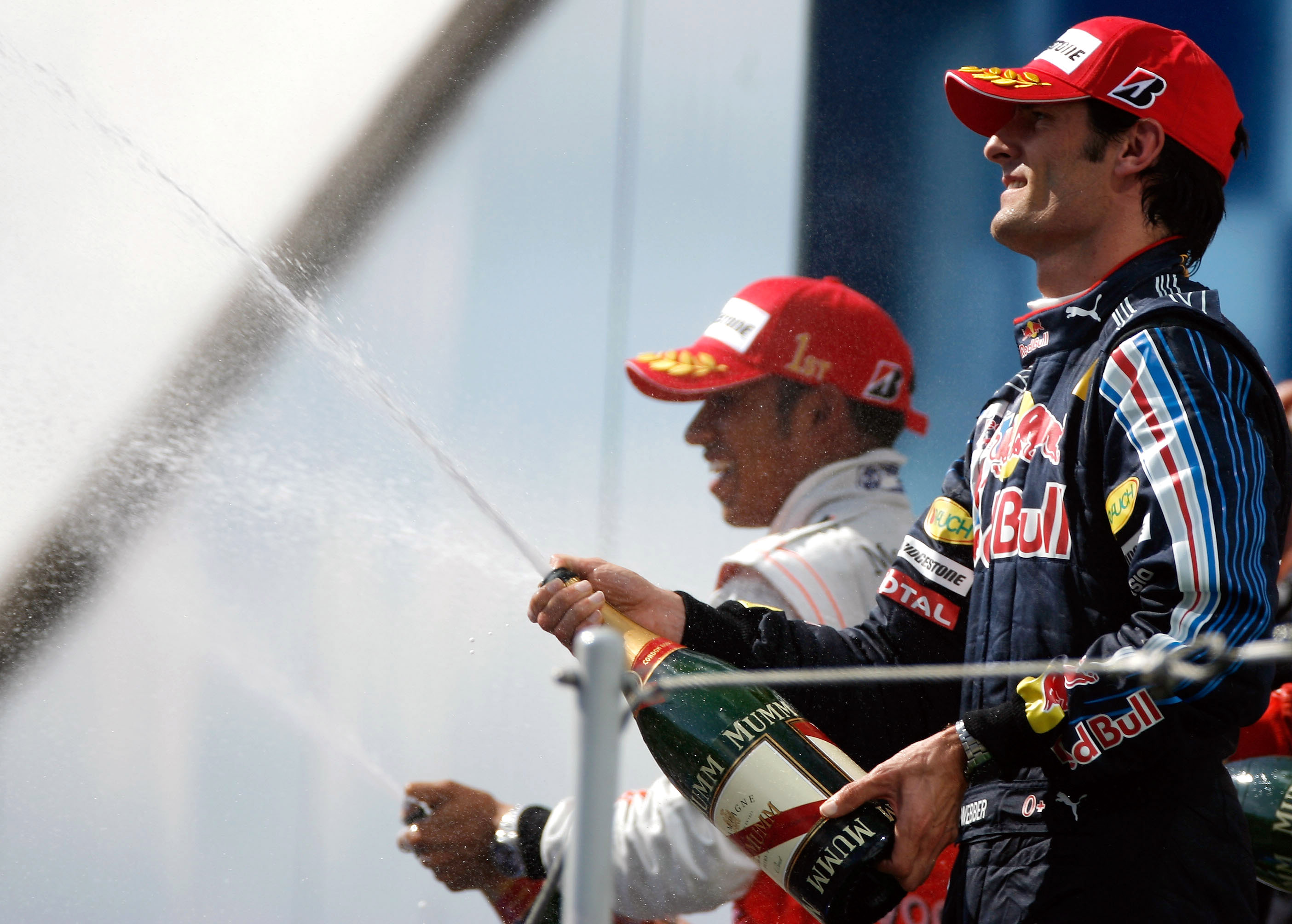 McLaren's Lewis Hamilton (in the back) won his first race in the 2009 season, while Mark Webber (in the front) was 3rd and is now closer to season leader Jenson Button. Photo by Paul Gilham/Getty Images