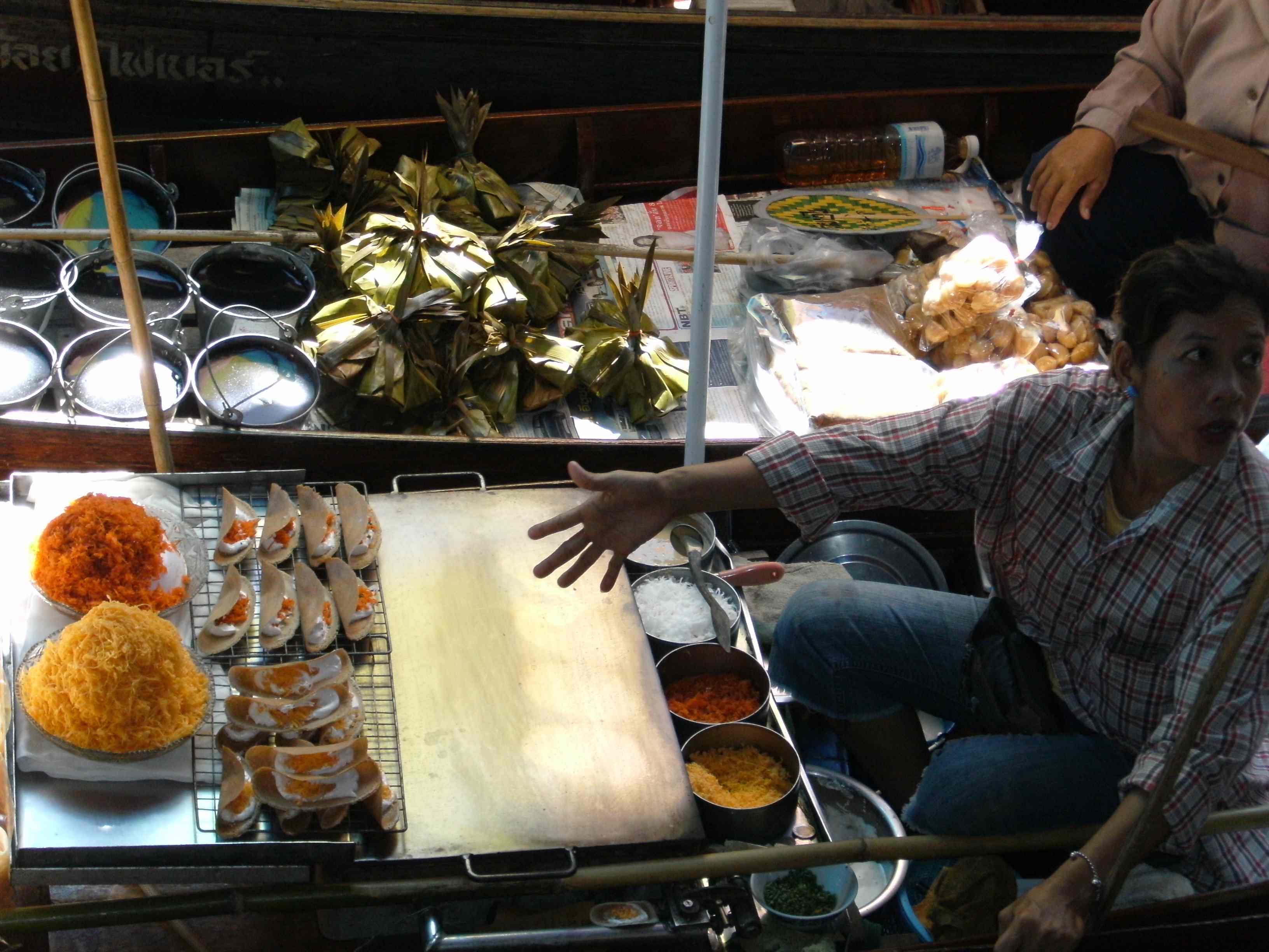 Haggling at the Floating Market, Bangkok, photo by Aaron Smith.