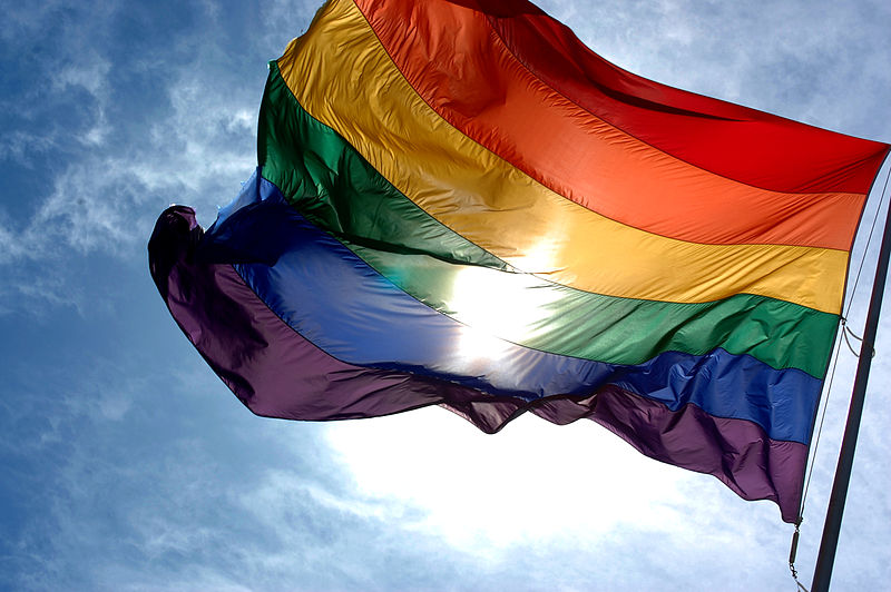 800px-Rainbow_flag_and_blue_skies