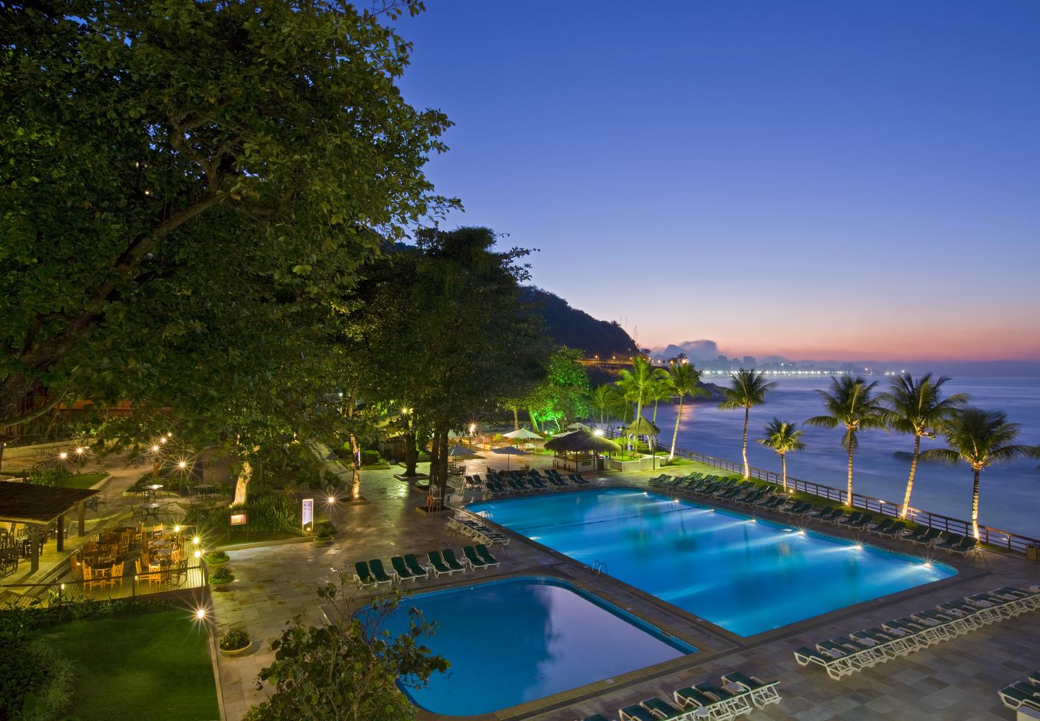 The Sheraton Rio Hotel & Resort pool lit up at sundown, Rio de Janeiro, Brazil News
