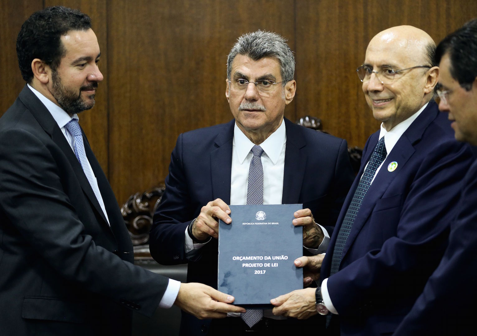 Brazil,Planning Minister, Dyogo Oliveira (L), and Finance Minister Henrique Meirelles (R), hand in 2017 Budget Bill to Senator Romero Jucá