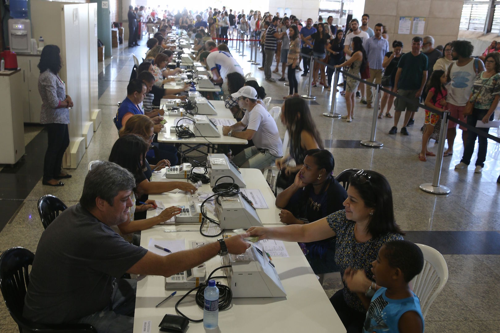 Brazil,Voters line up to justify not voting in their municipalities in Sunday's elections. These votes are counted as absenteeism