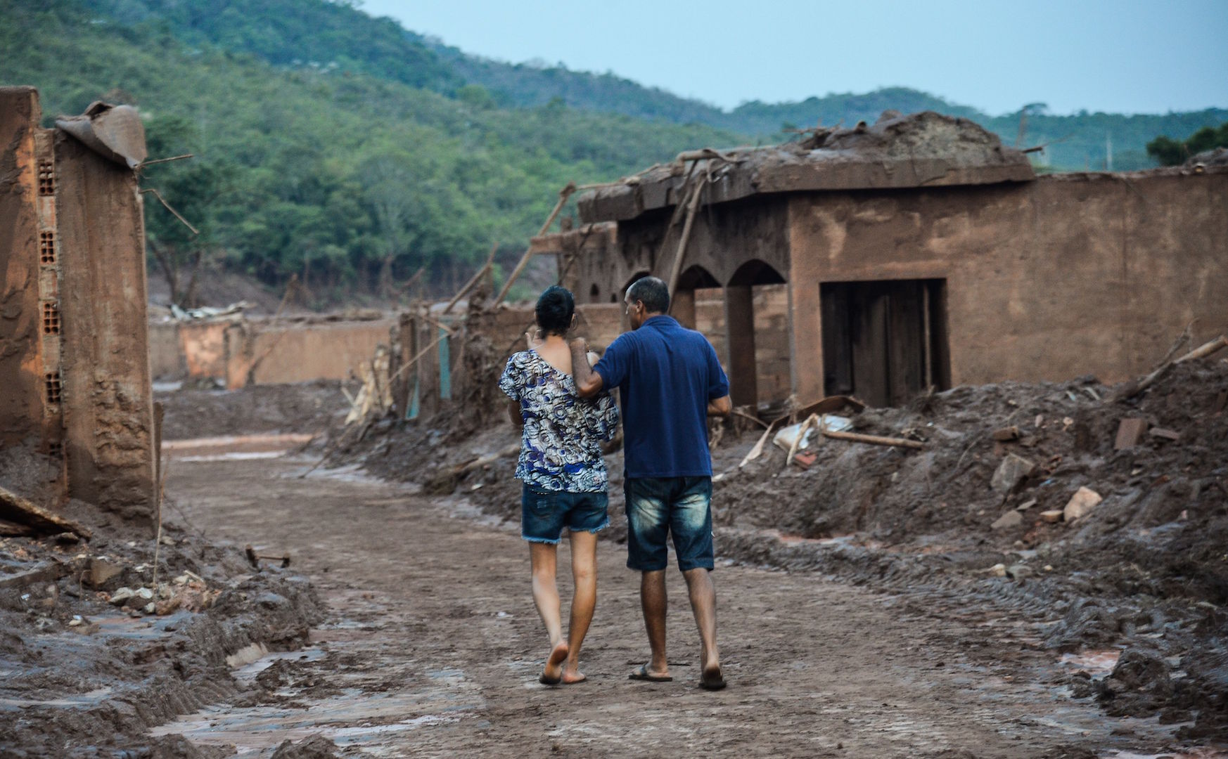 Brazil,Residents survey area devastated by mud after Samarco dam broke in Mariana,