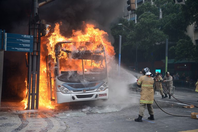 Brazil,Firefighters try to control flames in burning bus as protest turned violent in Rio de Janeiro,