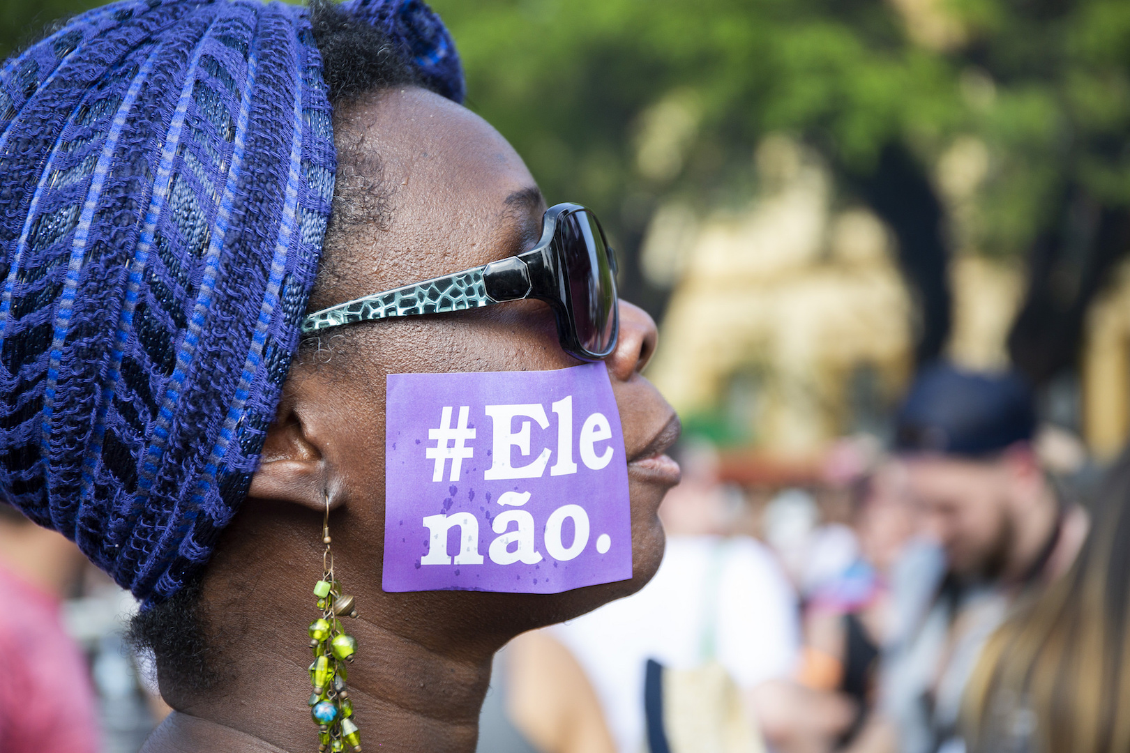 Woman with a "NotHim" sticker protests against right-wing candidate, Jair Bolsonaro.