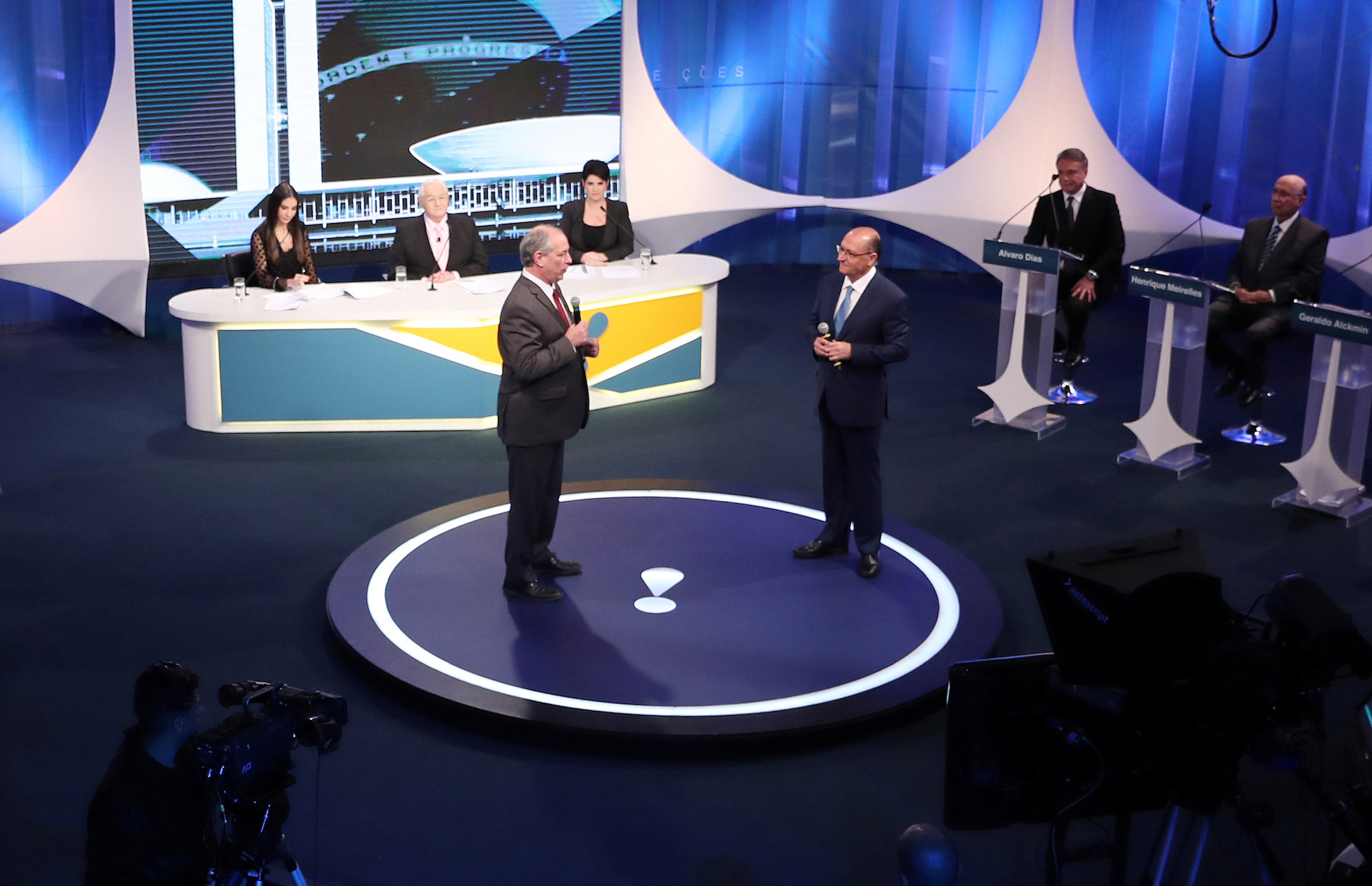 Presidential candidate Geraldo Alckmin speaks next to candidate Ciro Gomes during a television debate at the Rede TV studio in Osasco