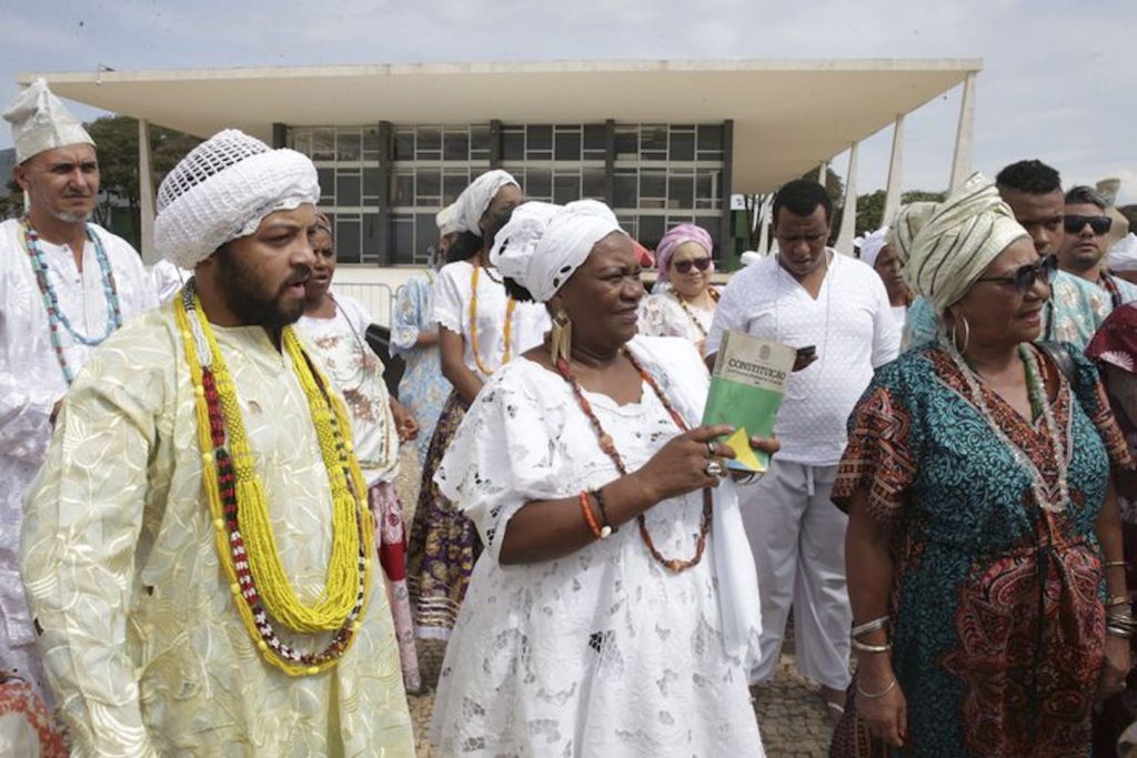 Candomble practitioners in traditional white ritual dress