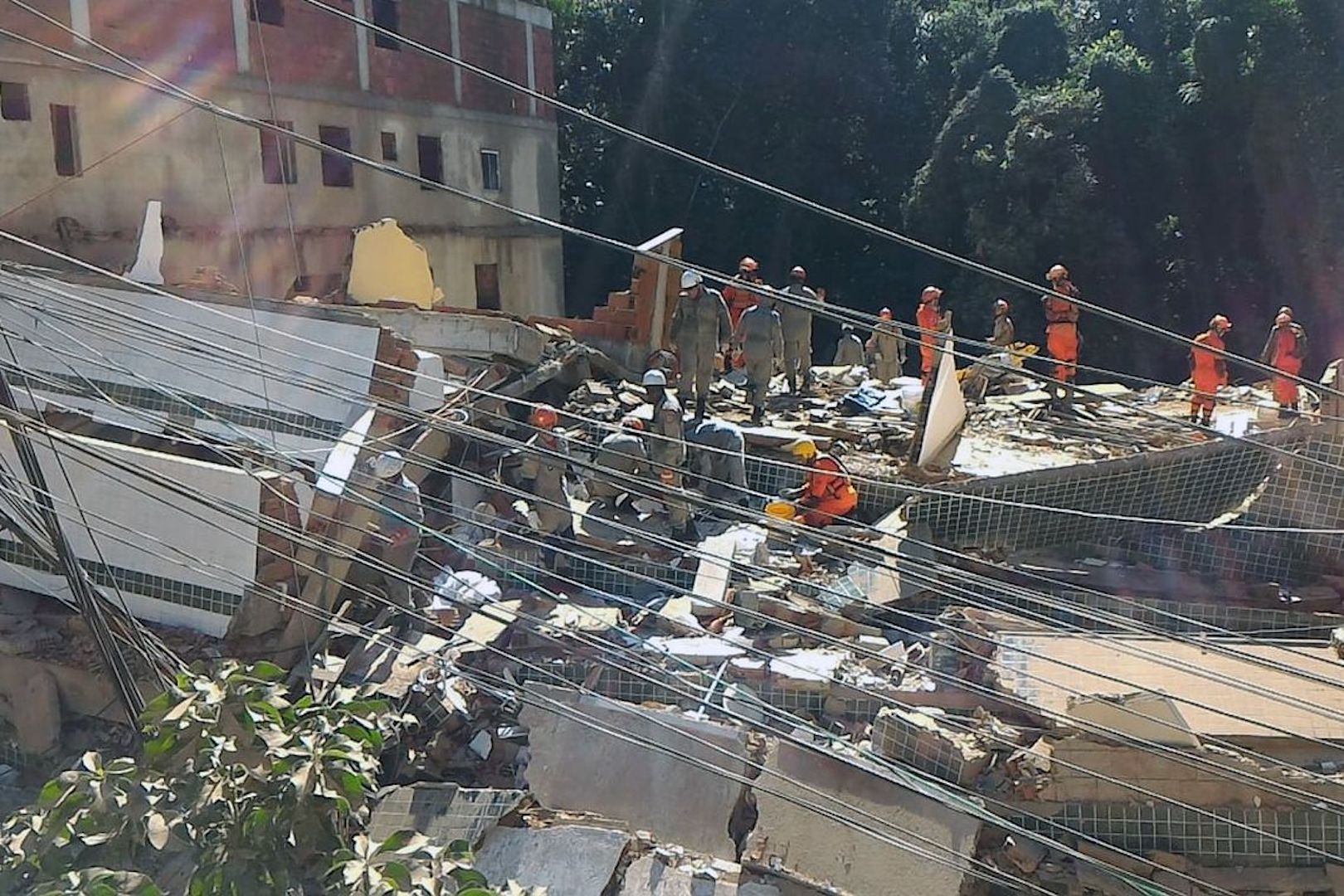 Brazil, Rio de Janeiro,Firefighters look for survivors in Friday's collapse of two buildings in the Muzema community in Rio de Janeiro.