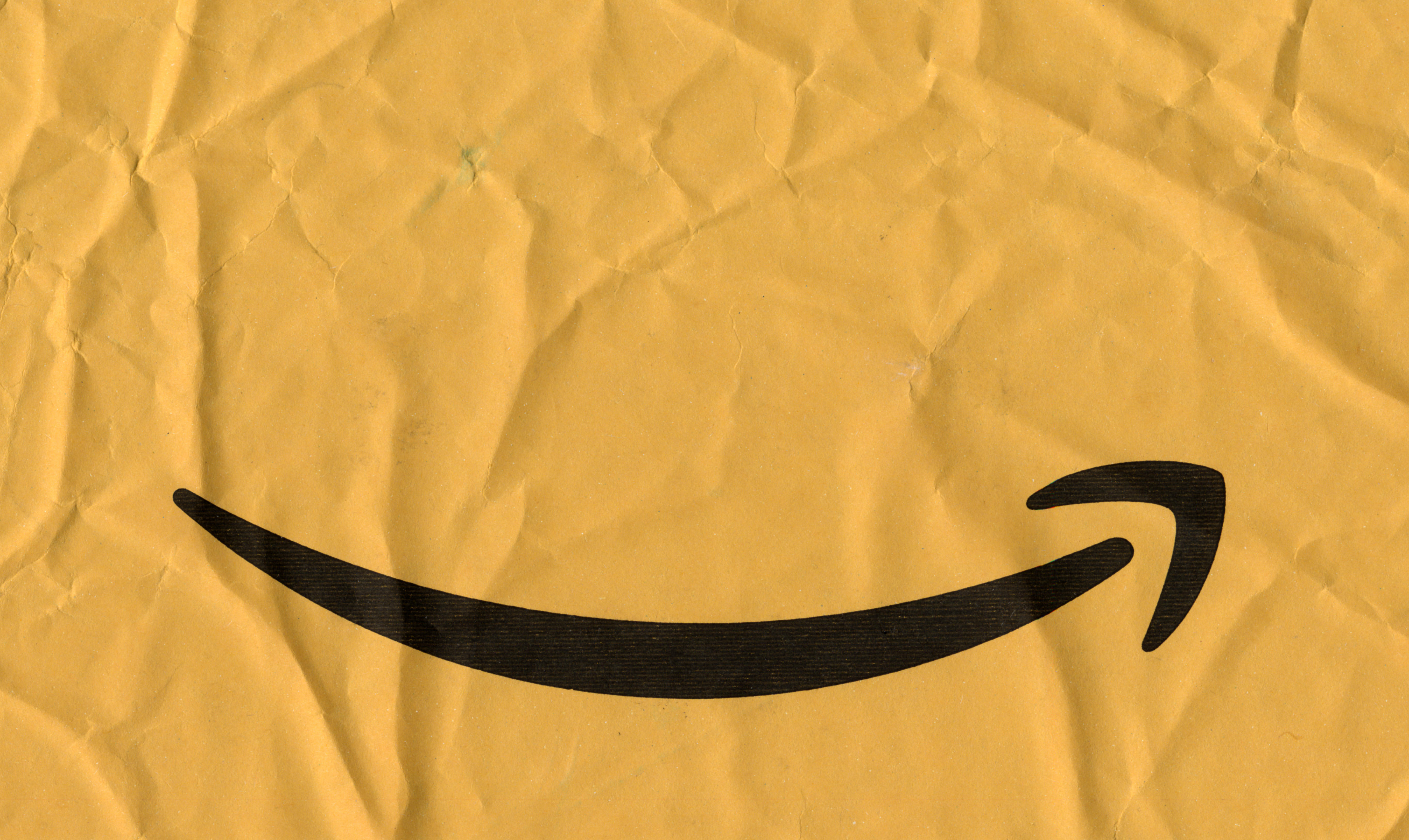 SEATTLE, USA - CIRCA MAY 2018: Amazon arrow logo on a packet