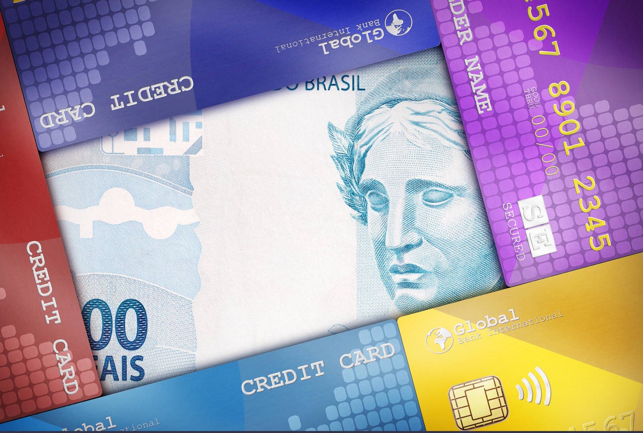 Credit Cards beautifully arranged to cover a money bill symbolizing financial concepts.