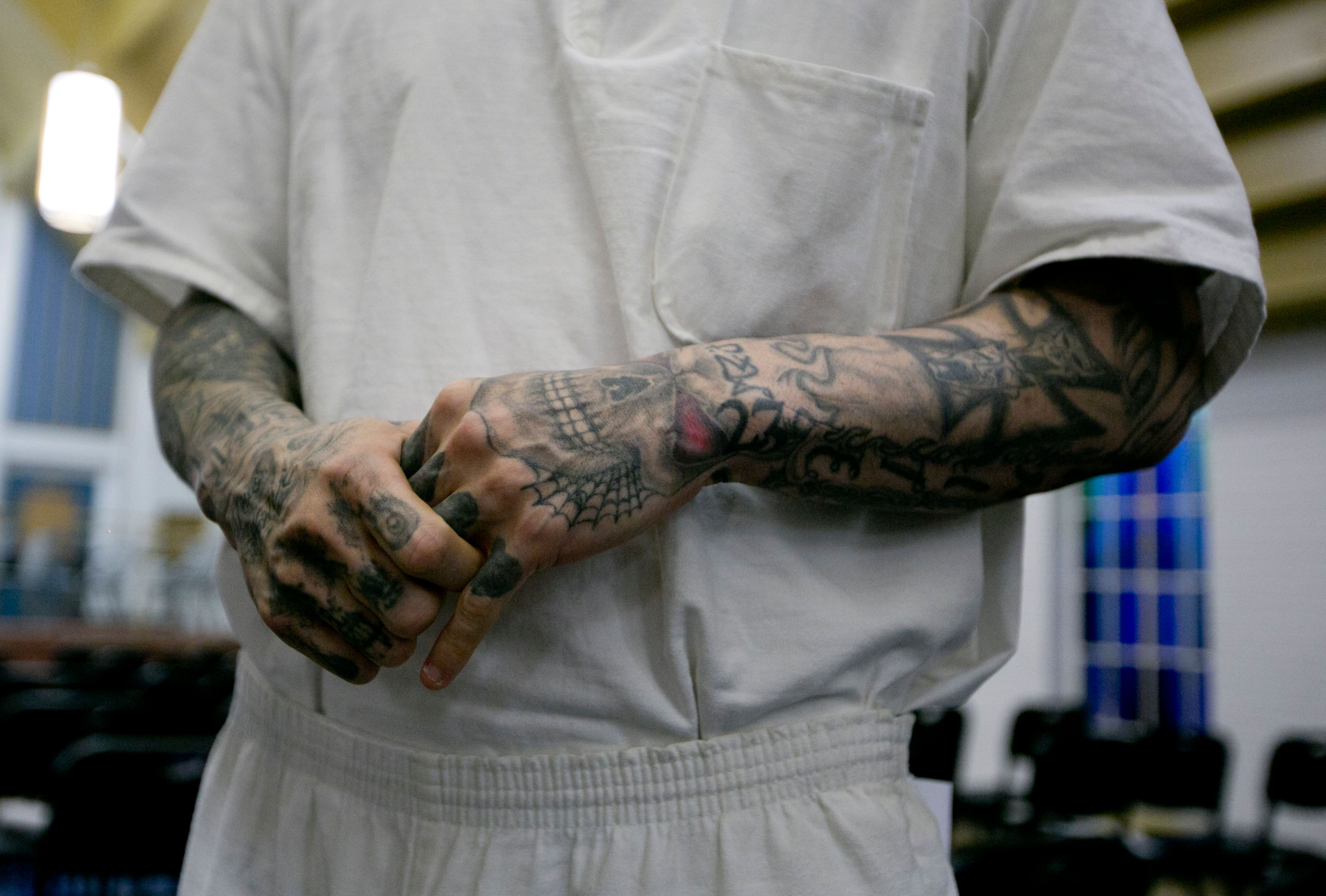 Male inmate with various tattoos on his arms inside maximum security prison near Houston, Texas. Image shot 08/2013. Exact date unknown.