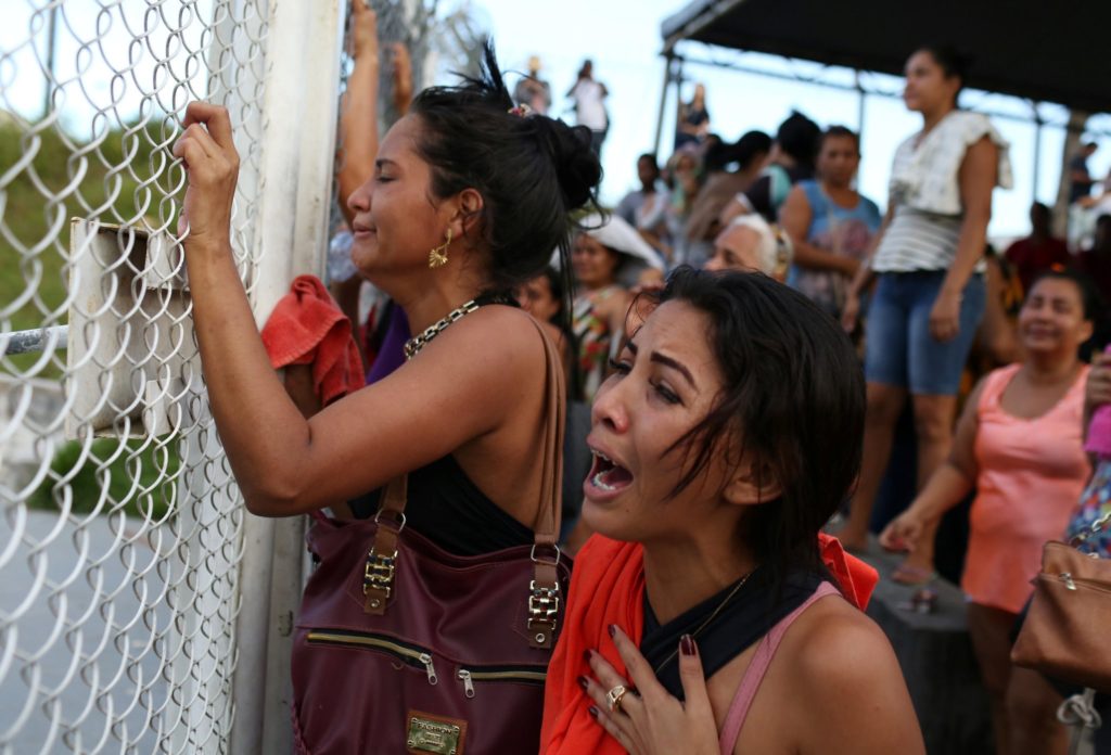 Relatives of inmates in front of a prison complex in the Brazilian state of Amazonas