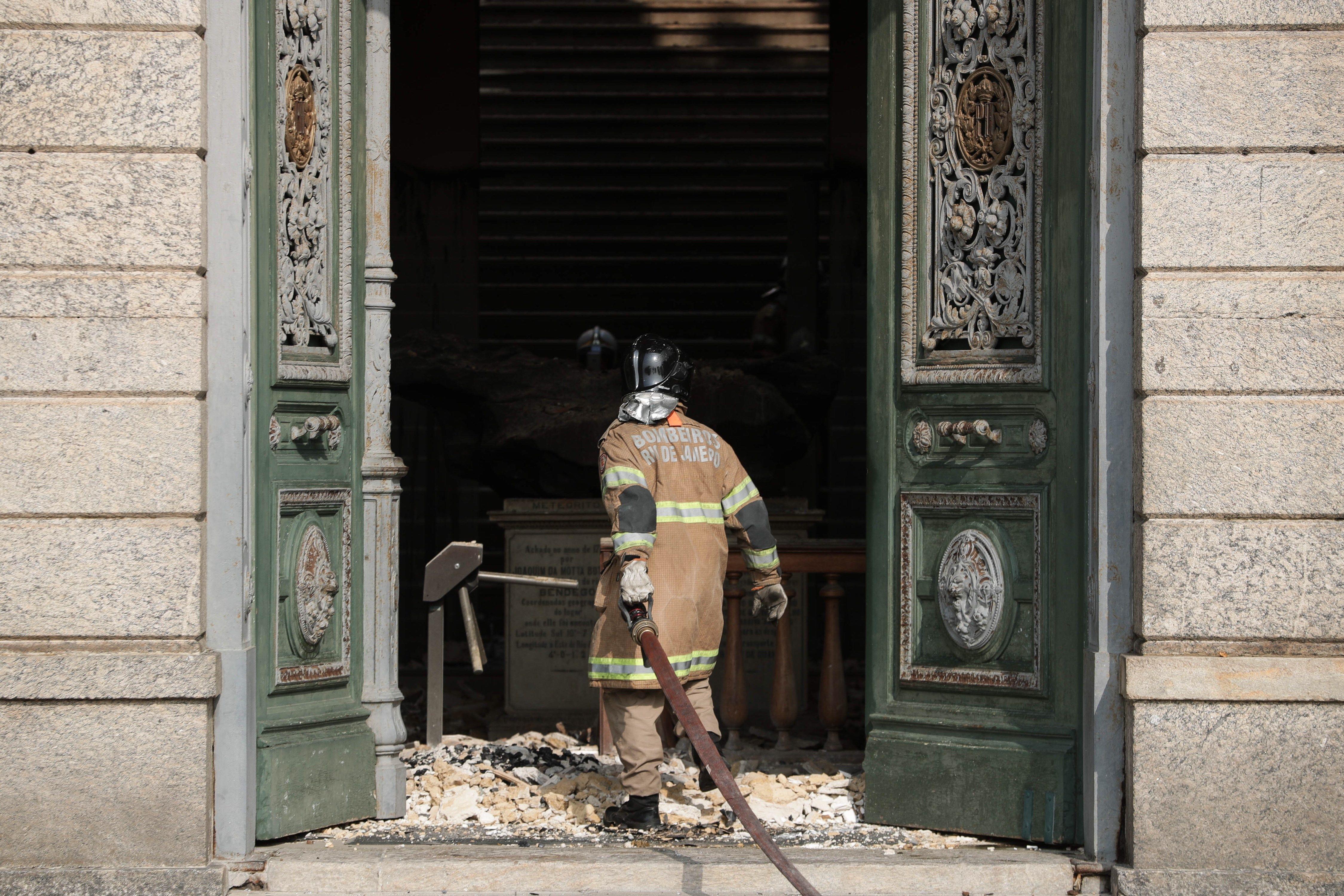 A firefighter at the National Museum of Rio de Janeiro, Brazil, 03 September 2018, after a fire destroyed the building on 02 September 2018. The National Museum of Rio de Janeiro, is the oldest in Brazil and housed some 20 million items, including the ske