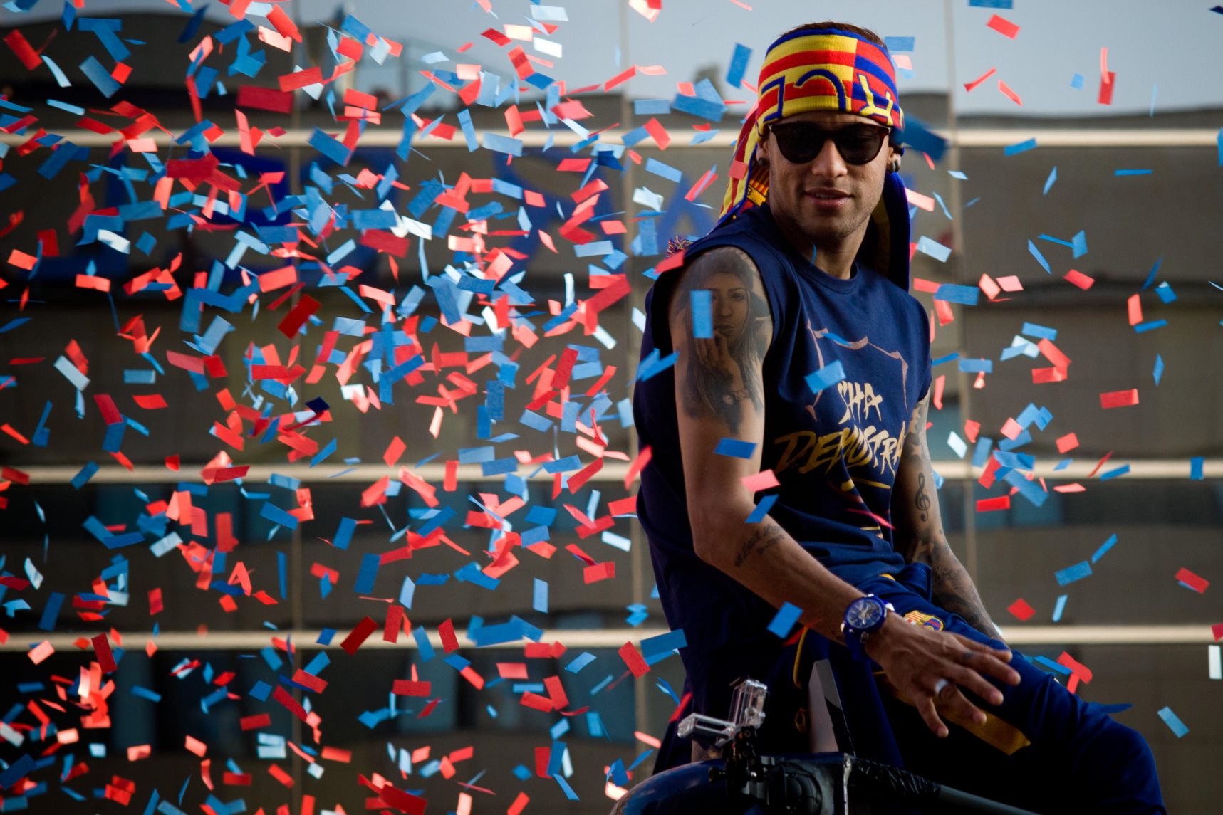 Barcelona, Spain. 15th May, 2016. FC Barcelona player Neymar is seen surrounded by confetti atop a open bus through the streets of Barcelona.  FC Barcelona players have celebrated winning the Spanish La Liga  2015/16 with a parade by Barcelona streets. Cr