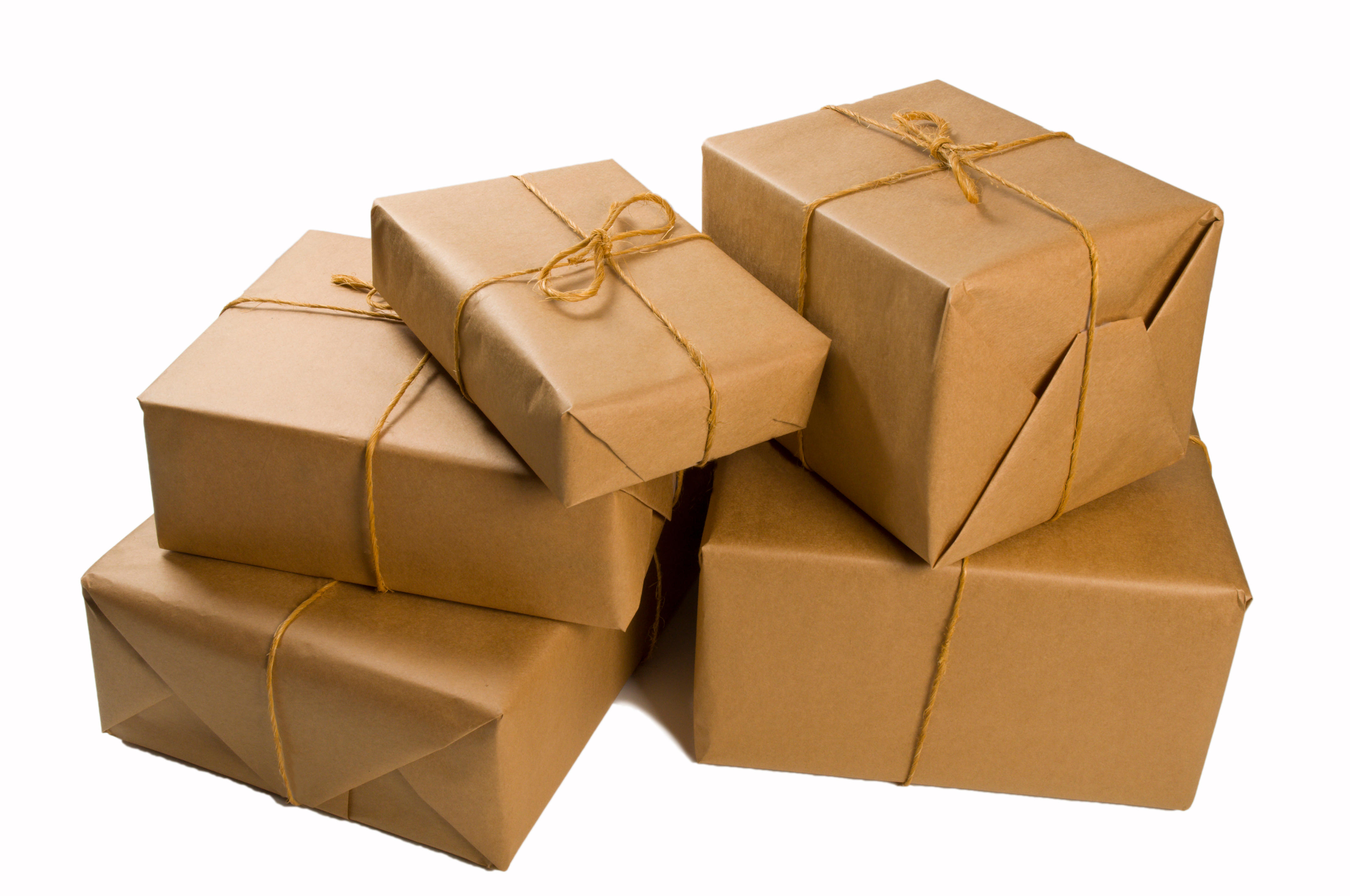 Stack of brown paper wrapped parcels for shipping