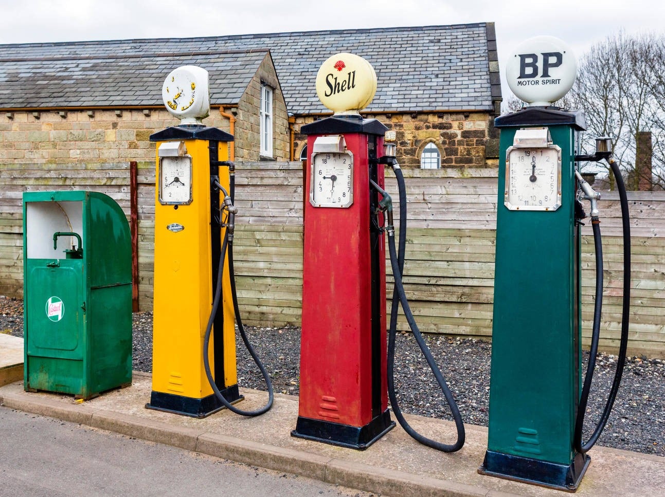 Old fashioned petrol pumps at a garage in the Black Country Living Museum, Dudley, West Midlands, UK