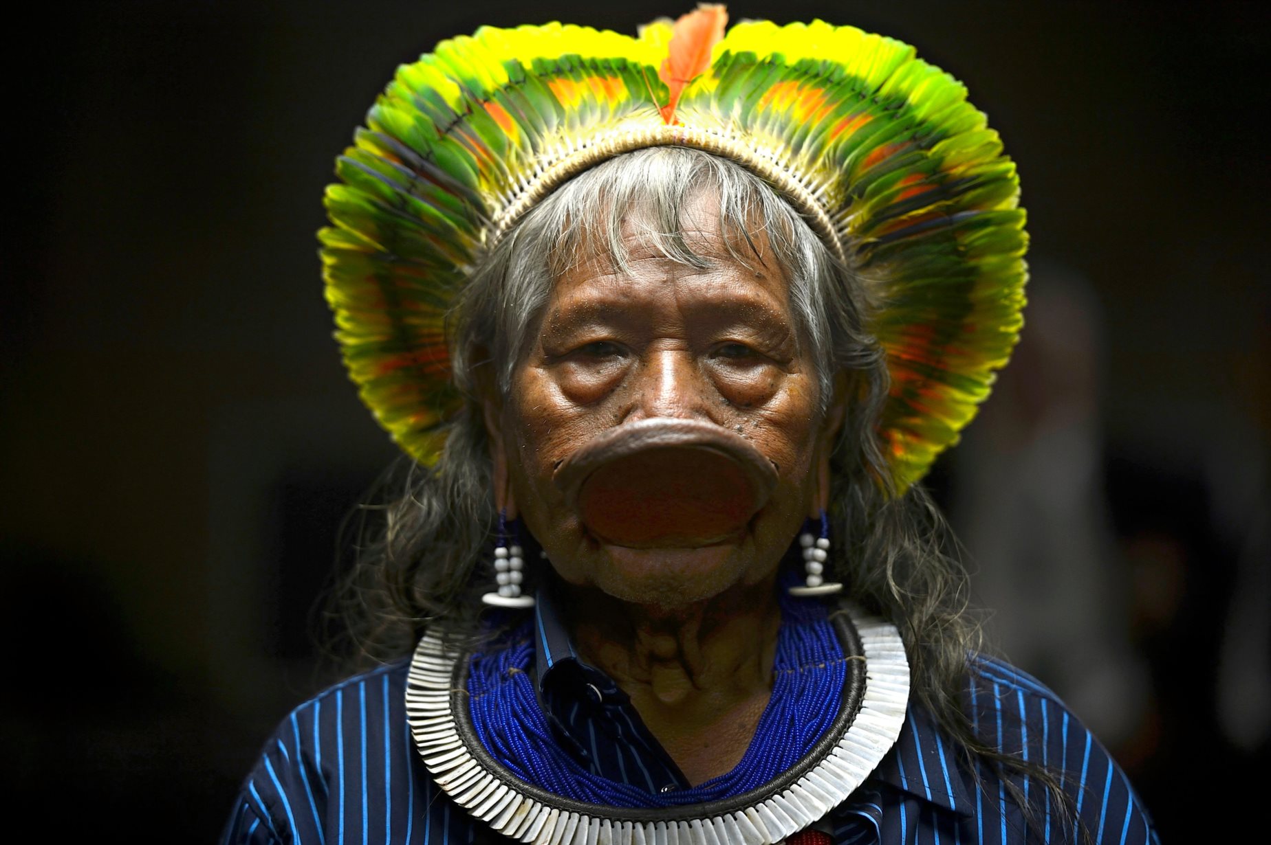 Raoni, distinctive with his yellow-feathered headdress and lip disc, became internationally known as a defender of the environment in the 1980s