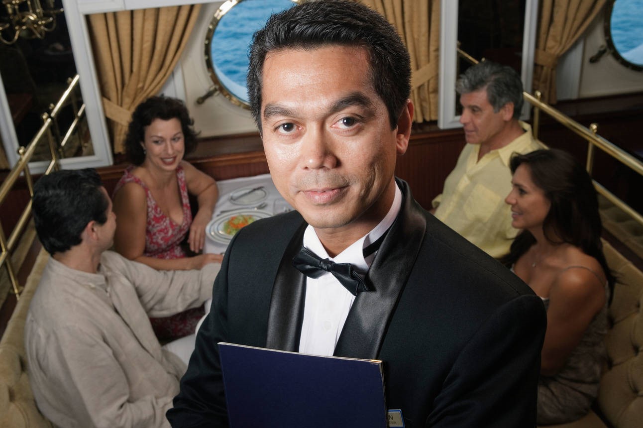 Waiter smiling in restaurant