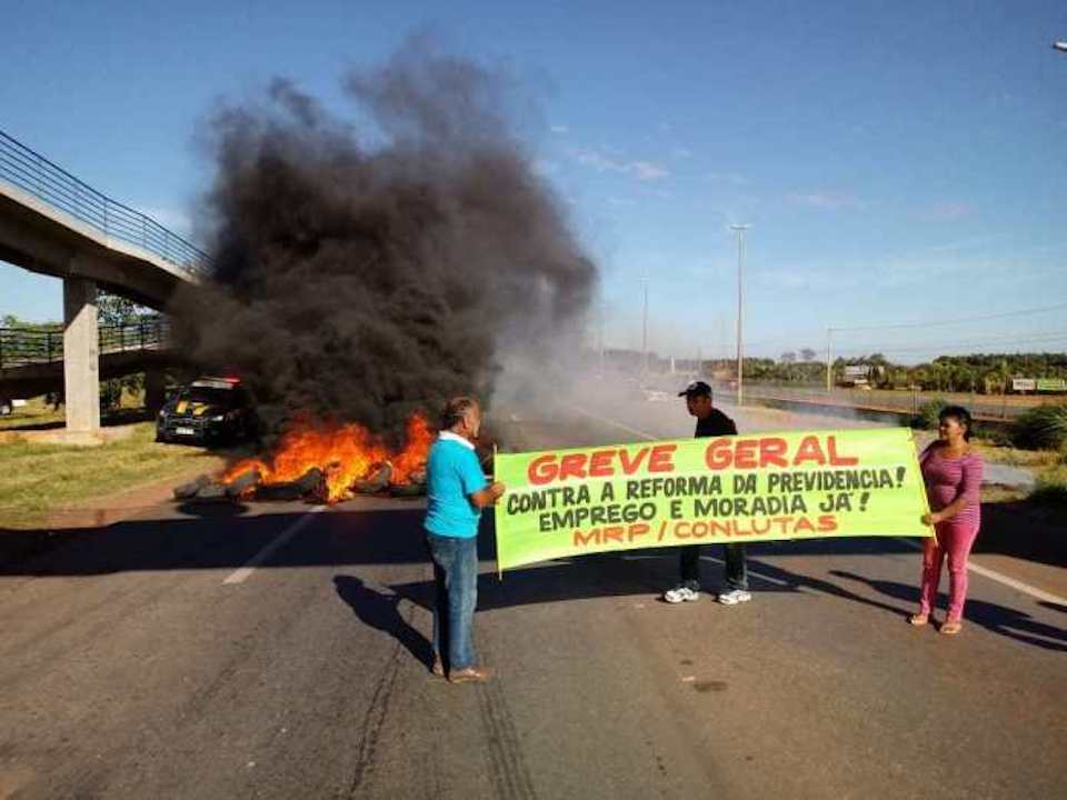 One of the main highways going into Sao Paulo city was closed due to burning tires placed along the pavement by protesters,
