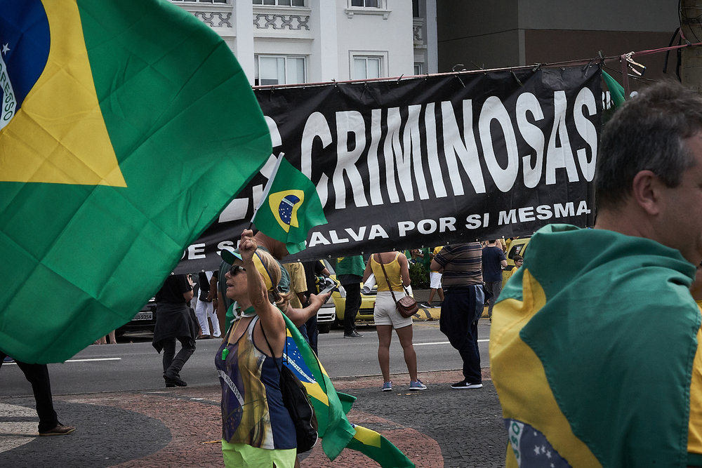 Pro-Bolsonaro supporters wave flags and show banners during a demonstration (Photo: C.H. Gardiner)