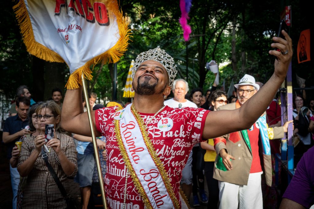 A gay man dances in São Paulo during a parade (Photo: C.H. Gardiner)