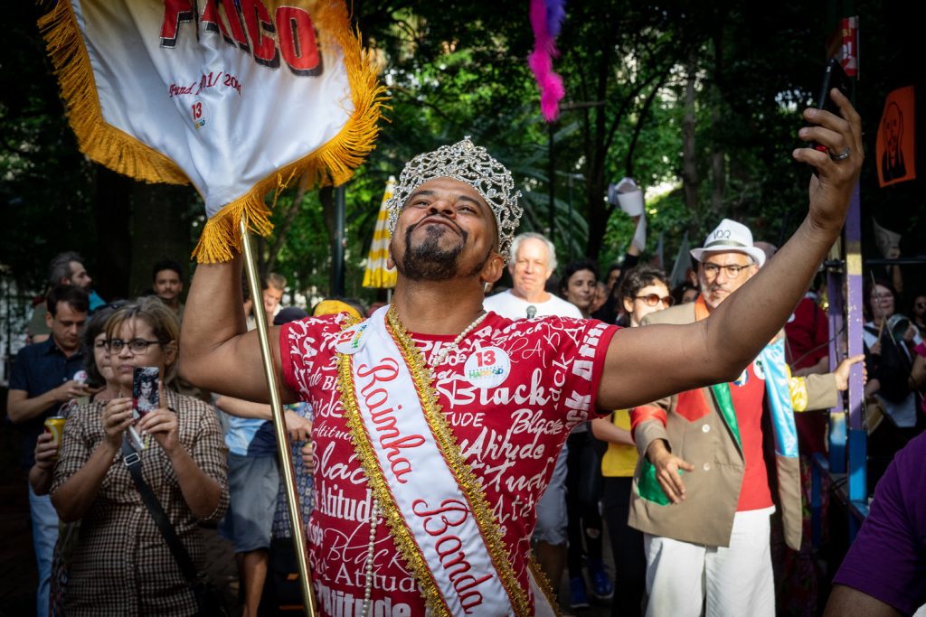 A gay man dances in São Paulo during a parade (Photo: C.H. Gardiner)