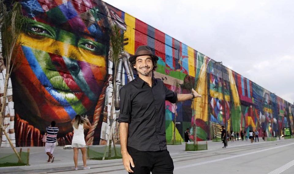 The artist Kobra in front of his mural called Ethnics, made in Rio de Janeiro for the 2016 Olympics. This is one of the largest graphite murals in the world, with three thousand square meters.