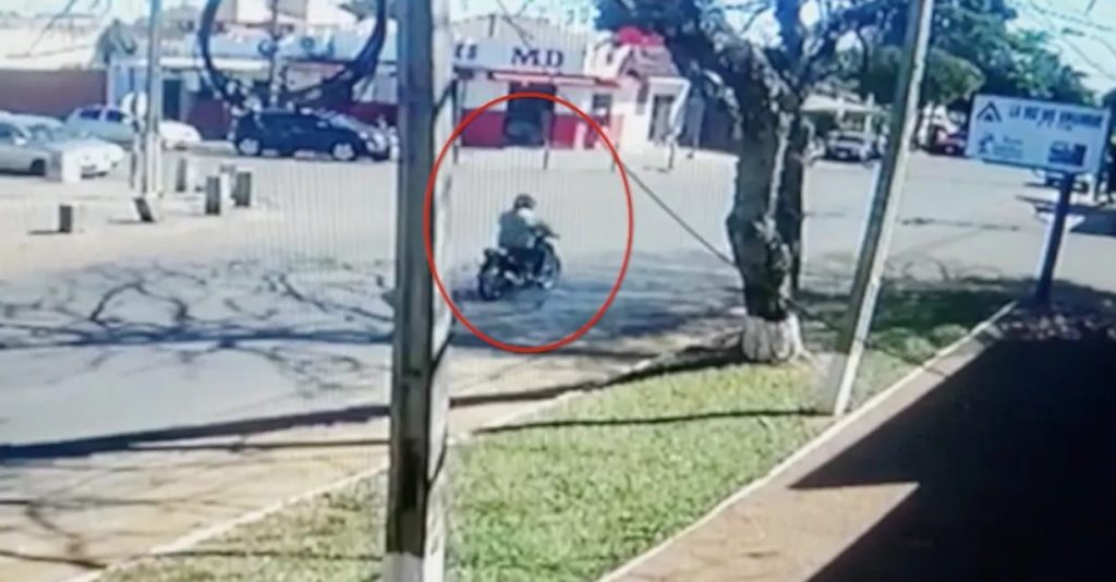 CCTV footage recorded the moment when a man on a motorcycle approaches the officer, shoots him and flees.