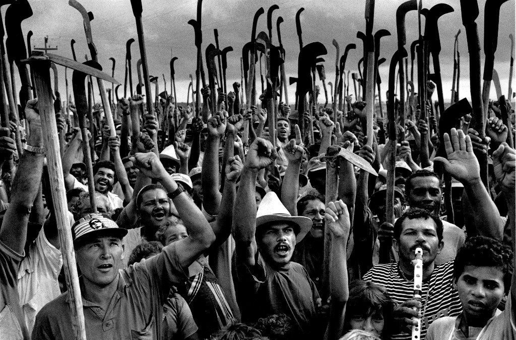 On April 17, 1996, 19 members of the Movimento dos Trabalhadores Rurais Sem Terra (Landless Workers Movement) or MST were shot by Pará state military police at the "S" curve of highway PA-150 in Eldorado do Carajás municipality, in southern Pará state. These people were part of a demonstration calling for the federal appropriation of a private ranch where the MST had mounted a camp called "Macaxeira" with almost 3000 families. On the orders of the state secretary of public security, Paulo Sette Câmara, the police were ordered to clear the highway "at any cost"[1]