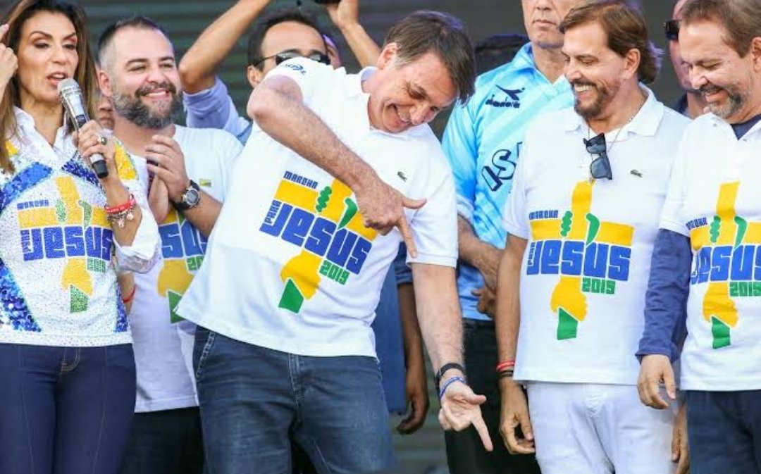 Brazilian president Jair Bolsonaro making gun-like hand gestures during the March for Jesus this year.