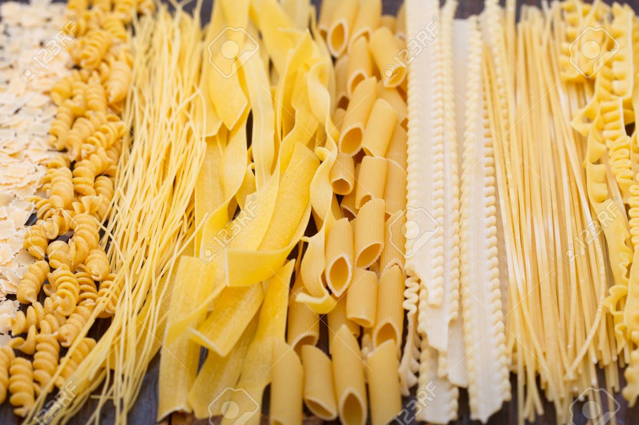 Different types of pasta, soup noodles and spaghetti. Food background.