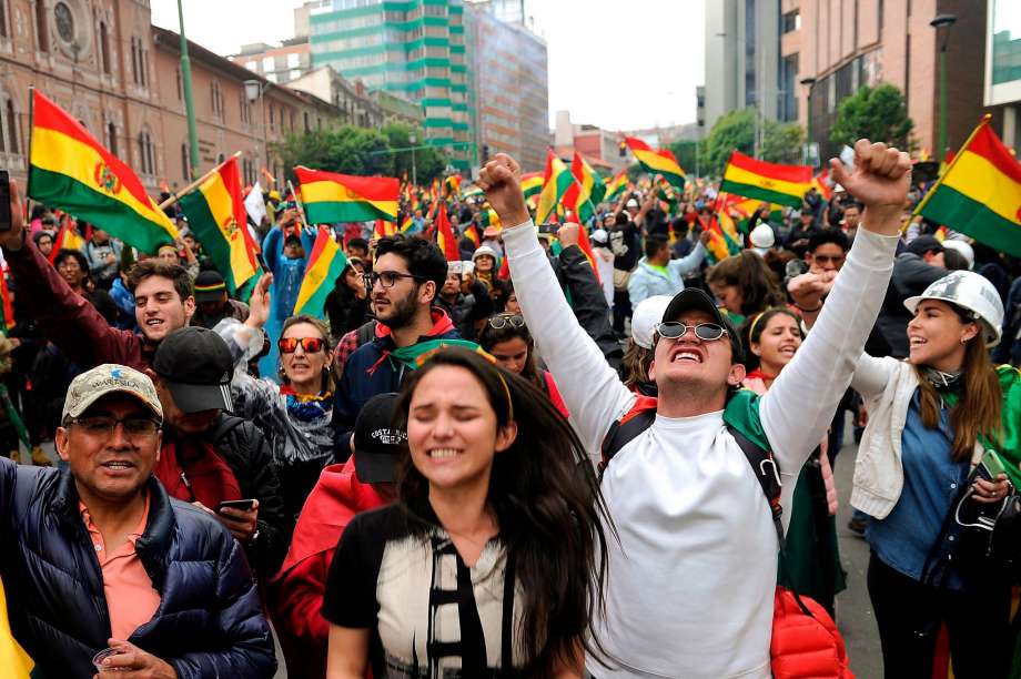 Bolivians celebrating the resignation of Evo Morales.