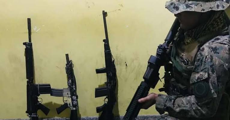 police officers seized "three rifles (two 762 caliber rifles and one 556 caliber rifle), three pistols, two grenades and a radio communicator" during the operation.