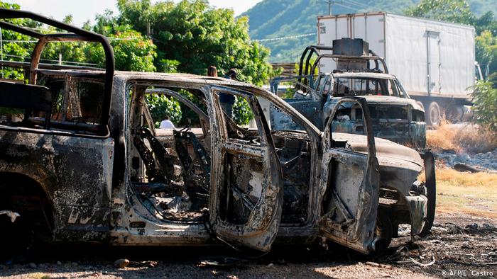 More than a dozen police officers have been killed in an ambush in the western Mexican state of Michoacan, authorities said. The Jalisco New Generation drug cartel is suspected of being behind the slayings.