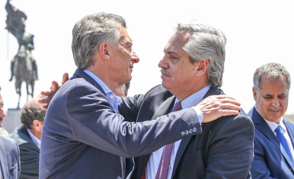 President Mauricio Macri and his successor, Alberto Fernández, embraced for a few seconds.