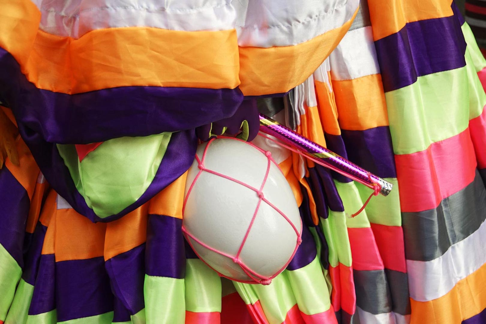 Brazil,One of the characteristic props of the Bate-bolas is the balloon on a stick which members bounce off the streets to make sound