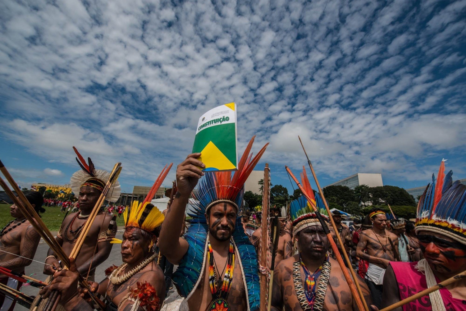 An indigenous man holds the Brazilian constitution in Brasília. Due to the coronavirus pandemic, the meeting will happen online this year.