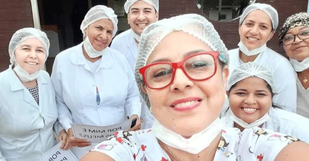 Nurse Carla Mileni Siqueira dos Santos (front, wearing red glasses) with her team.