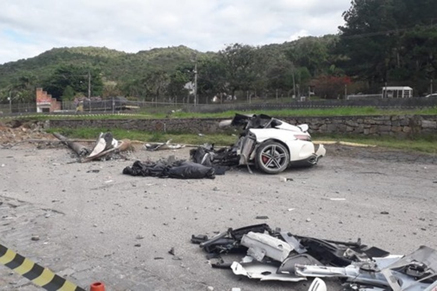 The entrepreneur's car went off-track and crashed into a post, breaking in half.