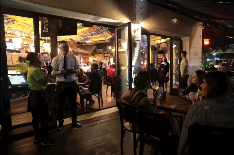 Rio Bar Customers Disregard Crowding and Mask Rules on First Reopening Day