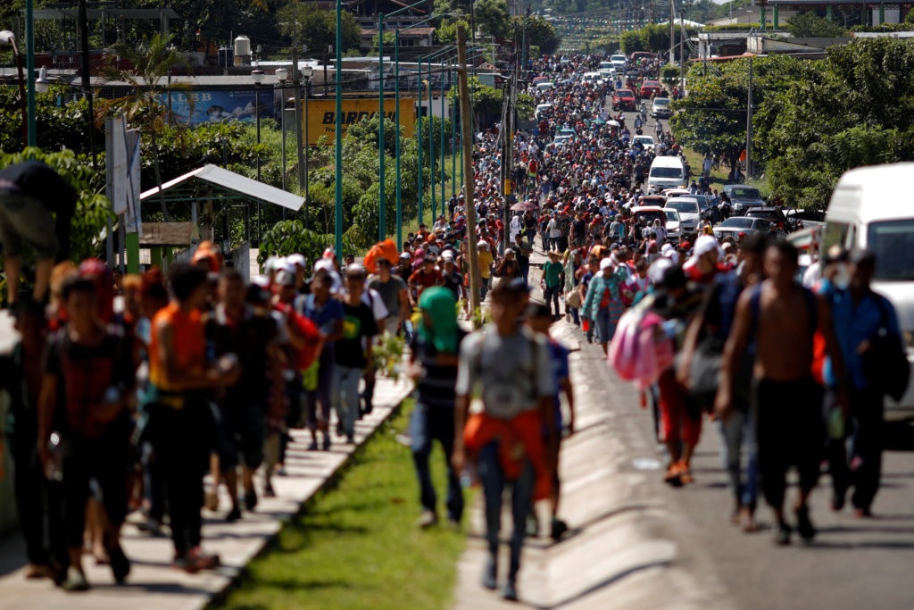 Central American migrants walk along the highway near the border with Guatemala, as they continue their journey trying to reach the U.S., in Tapachula
