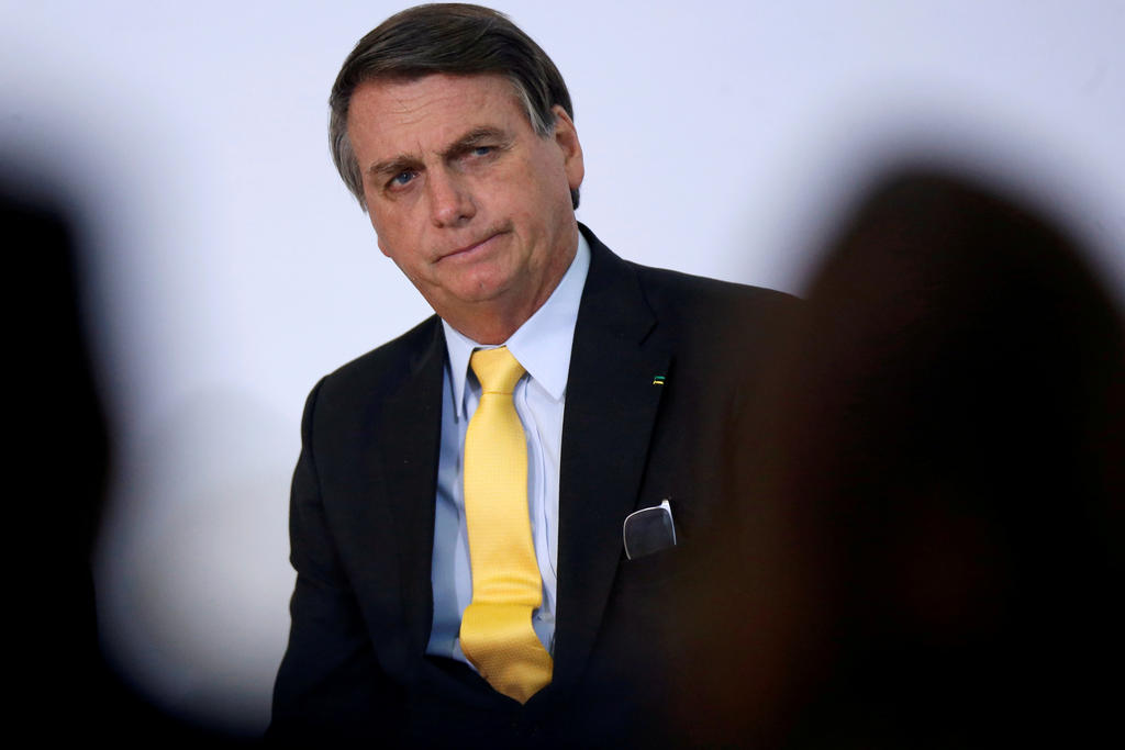 FILE PHOTO: Brazil's President Jair Bolsonaro looks on during the COVID-19 Clinical Study Result Announcement Ceremony in Brasilia