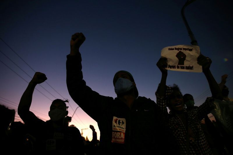 Demonstrators take part in a protest against racism, after Joao Alberto Silveira Freitas was beaten to death by security guards at a Carrefour supermarket in Porto Alegre