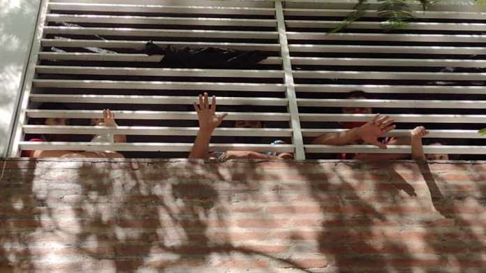 People Confined With no Distancing, Water or Food