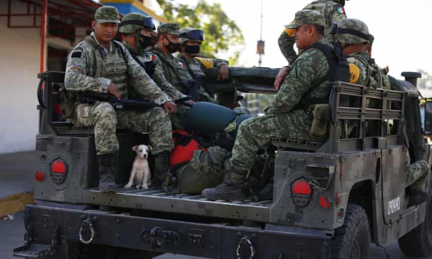 Mexican soldiers held by angry villagers after shooting of Guatemalan migrant