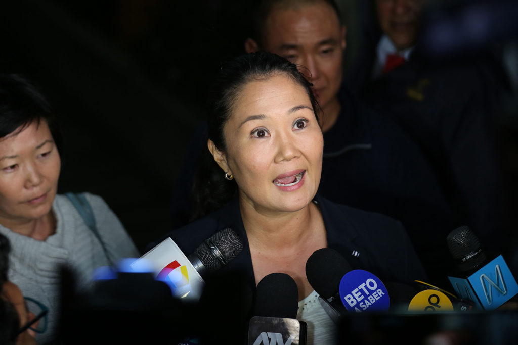 Keiko Fujimori speaking to microphones at a press conference