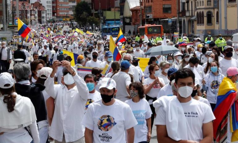 A white tide takes to the streets of Colombia in protest against the protests