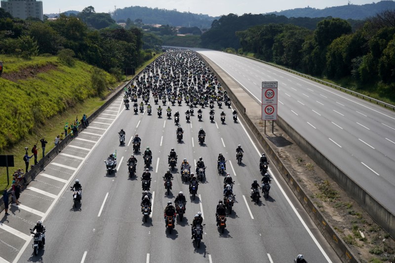 At biker rally, Brazil's Bolsonaro says cops will support him 'whatever happens'