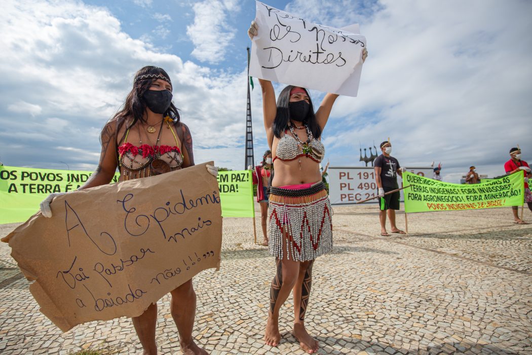 Protesters wearing feathered headdresses and body paint later tried to invade a downtown building
