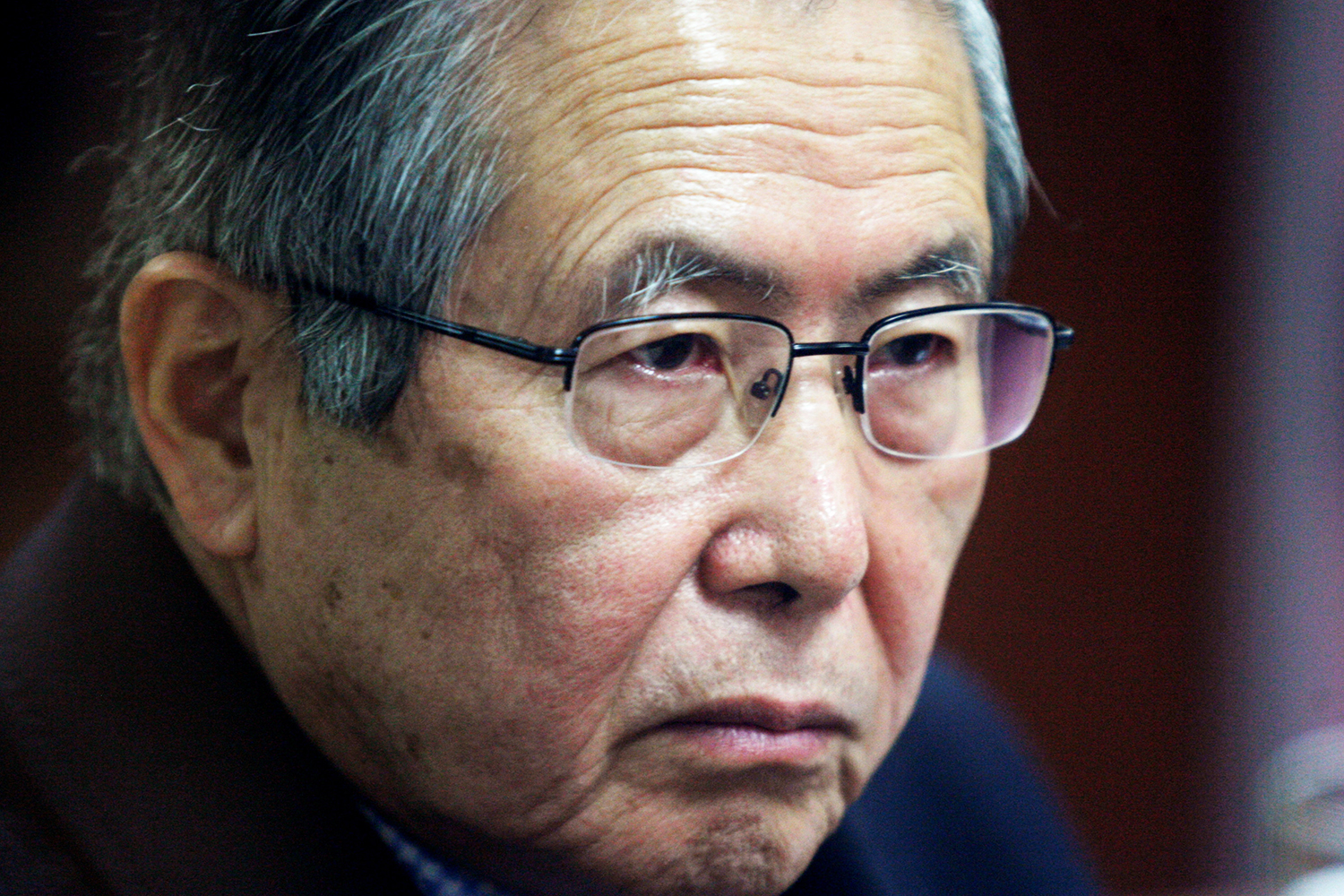 Former Peruvian President Alberto Fujimori attends his trial at the Special Police Headquarters in Lima, Peru